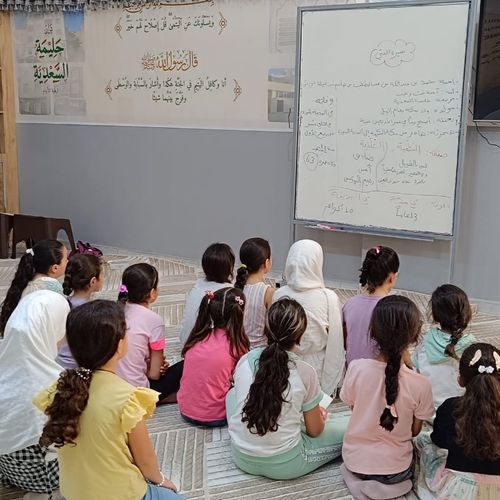 Our curious students listening to their teacher.